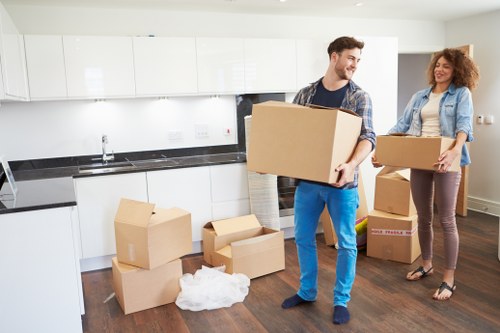 Professional movers handling a compact flat relocation